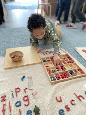 Words building with the movable alphabet Montessori materials.