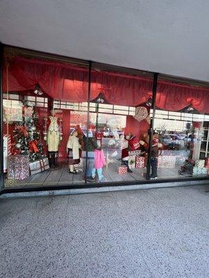 Christmases Past in the windows. The Exterior of Merry Go Round Antique Mall in Bakersfield  CA.