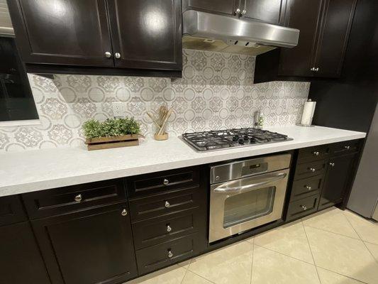 Finished quartz counter with tile backsplash