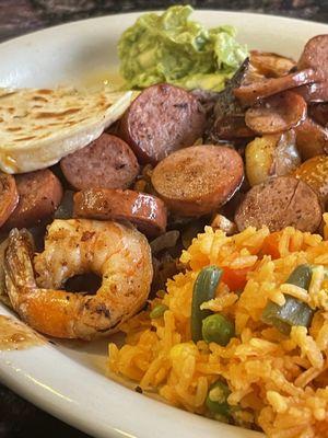 La Botana Beef, Chicken, Sausage, and Shrimp with Beans and Rice.