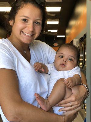 This is Arianna-Estrella Russo - Enjoying a couple of precious moments while the mom (customer) is doing her laundry.