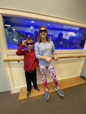 Fish tank in lobby- my kids in their awesome dilating sunglasses