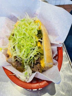 Philly Cheesesteak with lettuce and mild onion and peppers.