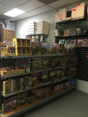 Nice selection of board games. including munchin, ticket to ride, catan, smash up, exploding kittens, cards against humanity and many more