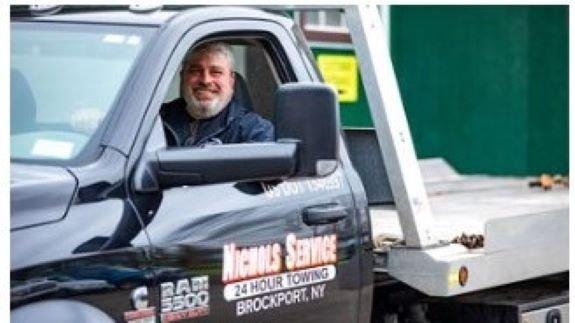 Owner Scott Waller behind the wheel of our flatbed.