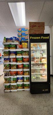 Small frozen food case & dried plantain strips of various flavors.