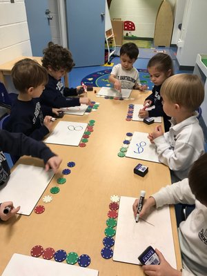 Using manipulatives and dry erase boards makes learning math fun for our Pre-K students.