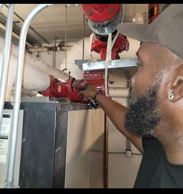 Our technician working on 600,000 BTU  heating system