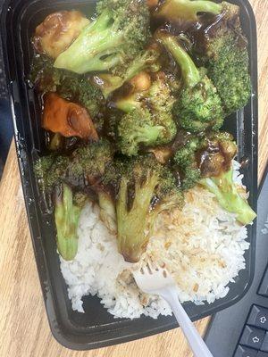 Shrimp and broccoli with white rice.