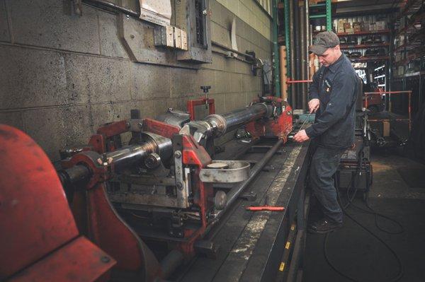 Lee, in our drive line repair shop, balancing a drive shaft.