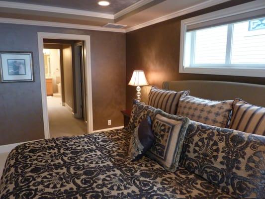 Cozy master bedroom with metallic finish on walls and ceiling.