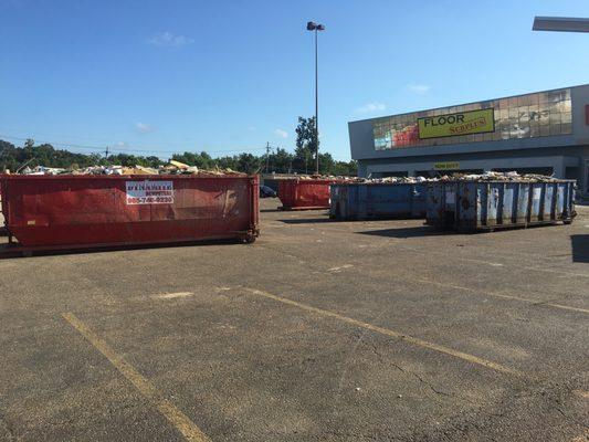 Older dumpsters on a job.