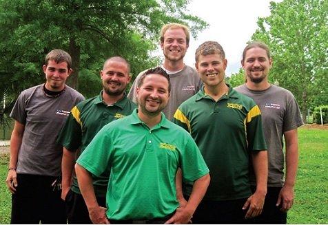 Local lawn care company with custom polos with embroidered company logo from Silverback Sports.