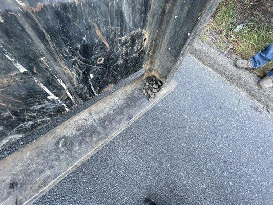 Rocks on bumper of vehicle that fell off and broke my windshield.