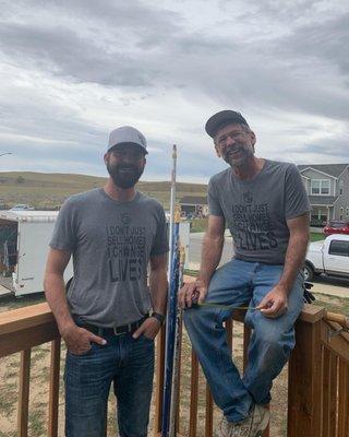 Zack and Bob taking a break during a Habitat for Humanity build.