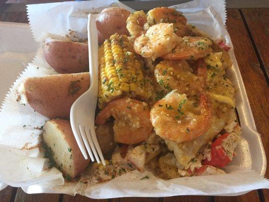 My husband for tilapia, shrimp,seafood mac and cheese with potatoes and corn. HUGE portion! He said it was good and it had amazing flavor!