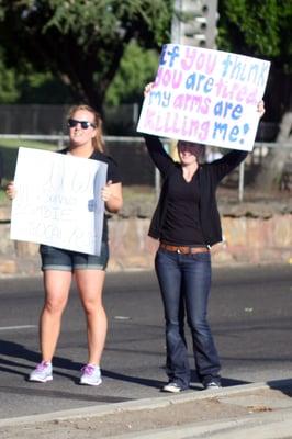 Spectators and their signs.