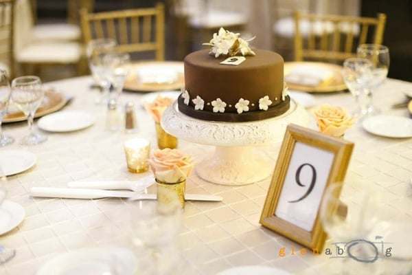 The flowers and votive candles did not overpower the cake centerpiece but complemented it. Just the way I envisioned!