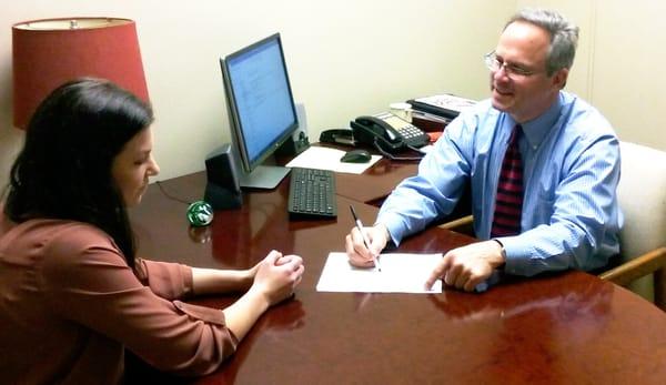 David working with a client on their taxes