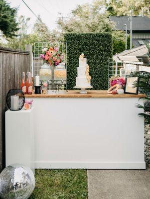 White classic bar rental & grass backdrop