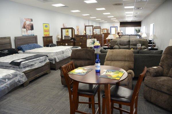 Store interior; recliners, beds, dressers, sofas, and dinettes.