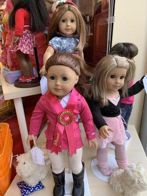 Most American Girl doll ranges from $40 - $60 in the Girl AGain boutique.