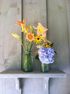 Flowers that were locally grown were placed in these antique mason jars