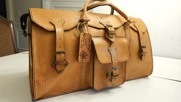 Handcrafted weekender bag with multiple pockets. Leather has been treated for light rain. Ideal for short trips.