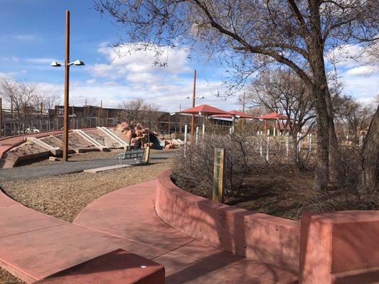 At the park, some of the slides are broken and others cannot be used due to the ground being too far from the bottom of the slides.