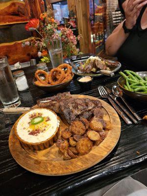 Bison ribeye special, onion rings, medallions, green beans