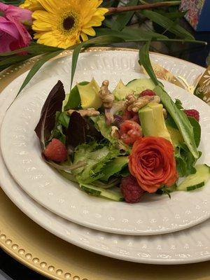 Mixed greens with Avocado, Raspberries, and Walnuts