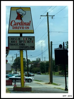 Cardinal Drive-in's curbside marketing.  NC's finest in the background.