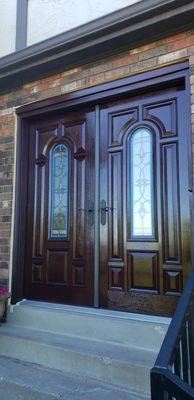 AFTER
Therma Tru fiberglass doors made to look like real Mahogany.