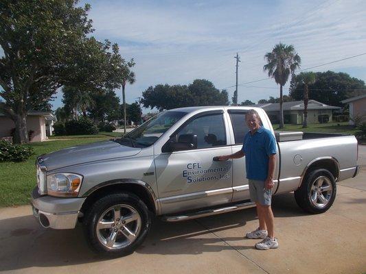 Chuck with the company truck