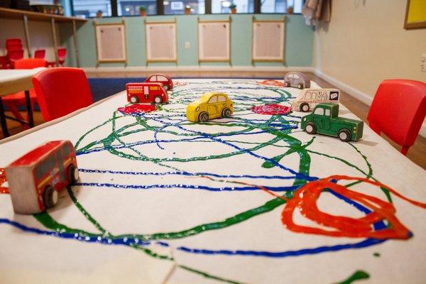 Beep beep! In a few moments, our toddlers in Toddle Around Art  & Music (12mos-2.5 years) will be in the driver's seat!