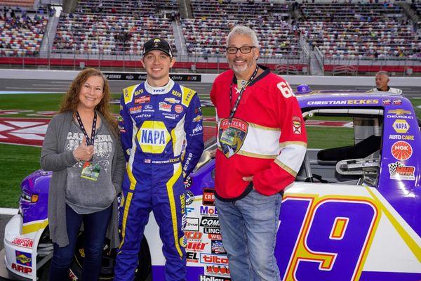 Lori and Dave Sirota with Christian Eckes at Charlotte Motor Speedway.