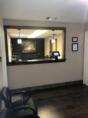 Front desk reception with convenient iPad check-in kiosk.