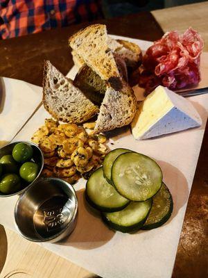 Meat & cheese board: Napoli salame and cheese like a Brie with olives, fried fava beans, pickled cucumbers