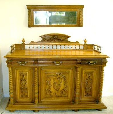 A Magnificent Carved Buffet/Console. Majestic in size and condition (67"x15"x39") Hand Carved Doors and Brass Drawer handles. Impressive .