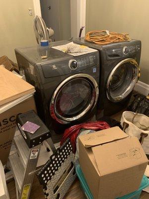 Dining Room with washer dryer and trash