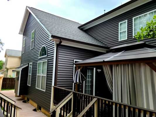 New Certainteed Monogram siding in Slate, crisp white soffit and fascia work and royal brown gutters & downspouts