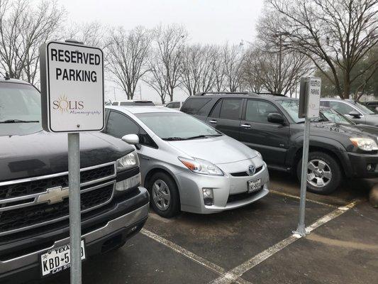 4 parking spots are reserved for Solis patients