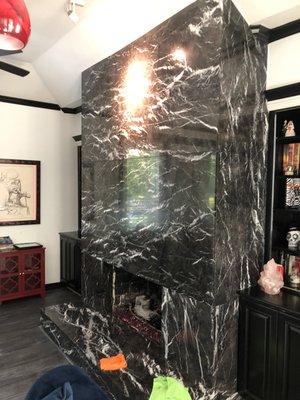 Polishing marble fireplace after flood damage repair