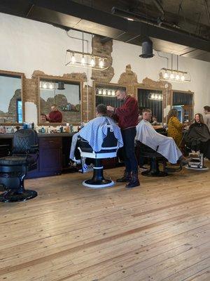 The owner Steven cutting my husbands hair and clean his beard.