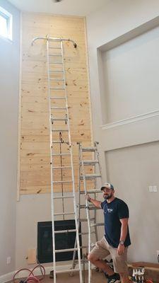 New shiplap installed above the fireplace, up to the 24ft ceiling.