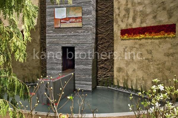 Fireplace and water feature by Kane Brothers, Inc