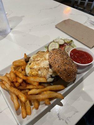 Burger with Swiss, egg, and grilled mushrooms