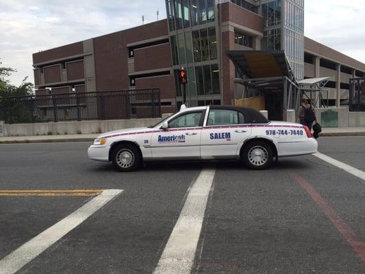 Americab going through a red light, while crosswalk light is on. Almost hit a pedestrian! This is why I'll use Uber for now on.