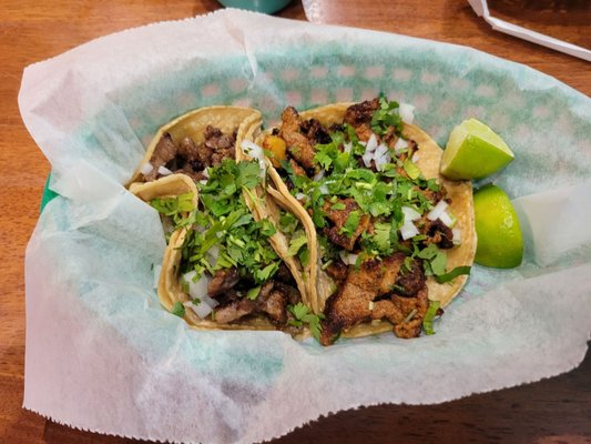 Taco Al Pastor (pork) and Taco Carne Asada (skirt steak)