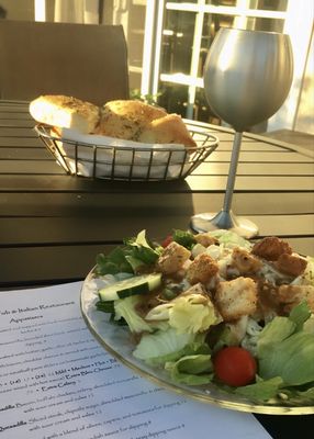 Adorable outdoor seating, delicious house salad & wide variety of wine.